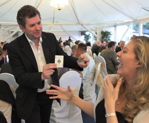 Magician entertaining lady at a wedding