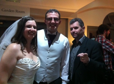 Mike with the bride and groom