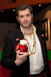 Mike holding Father Christmas doll