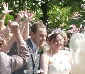 Wedding couple with confetti
