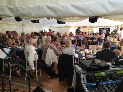 Lots of people in a marquee